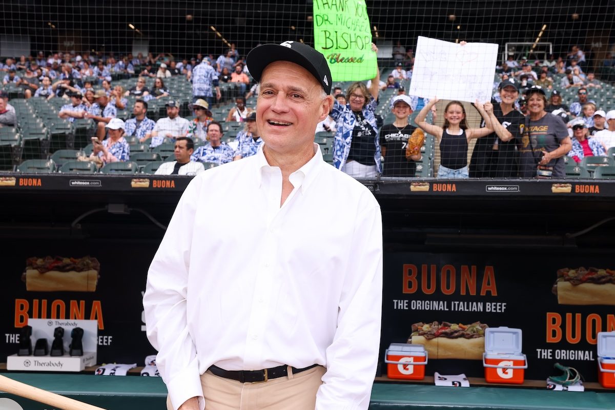 Michael Bishop, MD at the game where the White Sox Charities gift was announced, with some of his patients in the background.