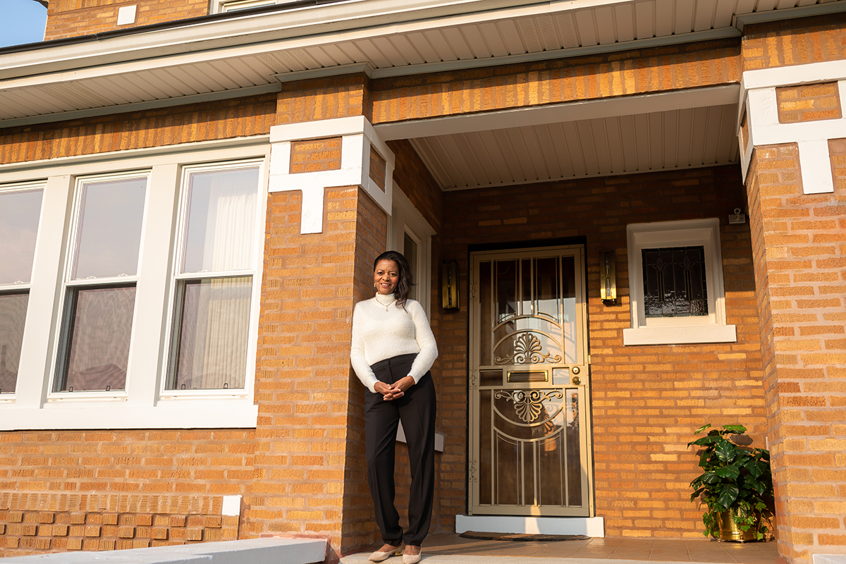 Photo of Natalie Ford standing on her front porch