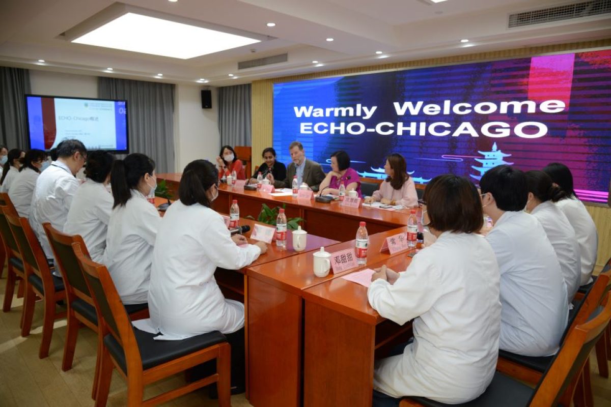 Daniel Johnson, MD, professor of pediatrics at UChicago Medicine and founder and director of ECHO-Chicago (center, left) and team (Kanika Mittal, front-left; Karen Lee, back-left) met with doctors and administrators at Tongji University School of Medicine to establish their partnership.