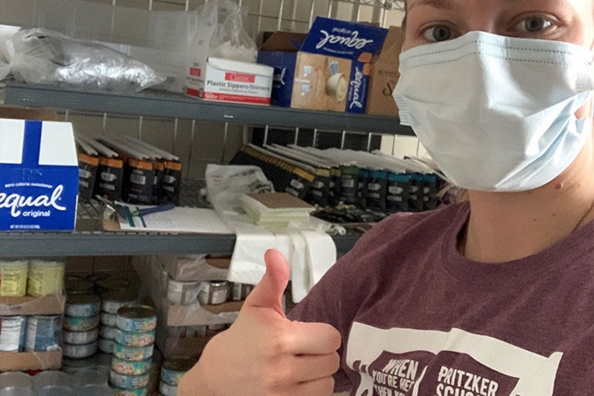 University of CHicago Pritzker School of Medicine studen Rachel Rolinski stocks a food pantry for cancer patients.
